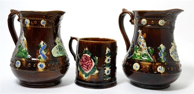 Lot 244 - Two Measham bargeware jugs, ";Love at Home"; and ";God Bless Our House";, 19cm and 18cm high; and a