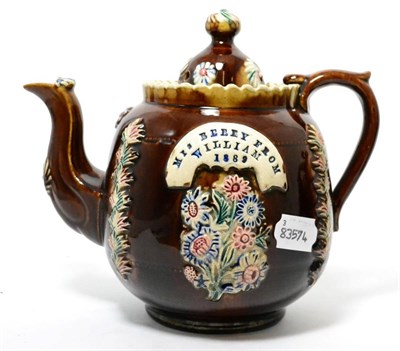 Lot 245 - A Measham bargeware teapot and cover, inscribed MRS BERRY FROM WILLIAM 1889, 20cm high