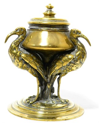 Lot 248 - A Victorian brass inkwell on three stork supports, 16cm high