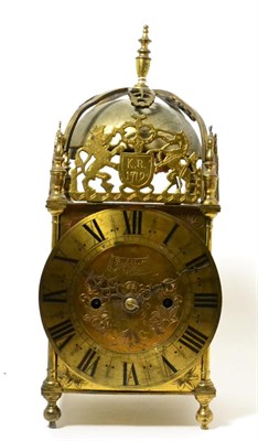 Lot 258 - A brass lantern clock, circa 1900, four posted case with pierced frets, engraved side door...