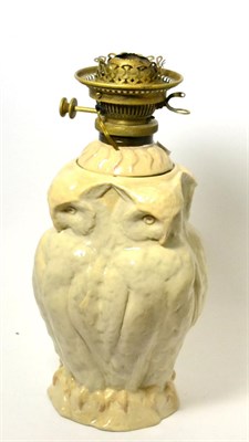 Lot 260 - A German stoneware lamp base and reservoir, modelled as four perched owls, 33cm high, with oil lamp