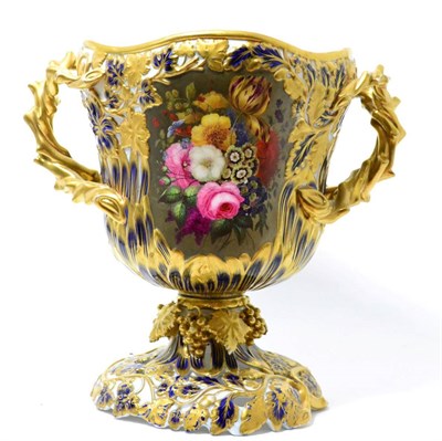 Lot 264 - A French porcelain twin-handled vase, mid 19th century, painted with flowersprays on a blue and...