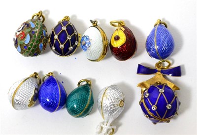 Lot 288 - Nine egg charms and an ball charm, enamelled in various colours and some hinged to open