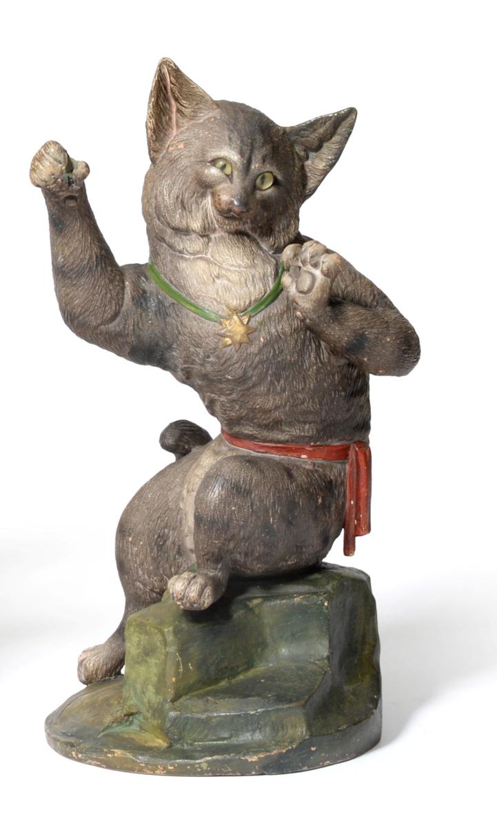 Lot 625 - A French cold painted terracotta figure of a cat, circa 1900, sitting upright, its forepaws raised
