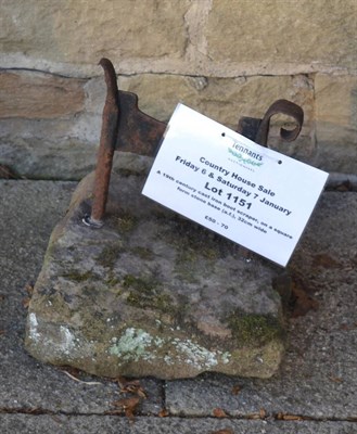 Lot 1151 - A 19th century cast iron boot scraper, on a square form stone base (a.f.), 32cm wide