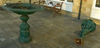 Lot 1156 - A large green painted cast iron garden water feature, the top section as a Classical figure holding
