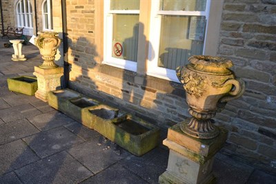 Lot 1157 - A pair of large composite garden urns, the lobbed rims above a baluster shaped body with...