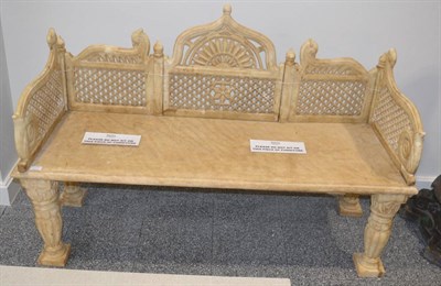 Lot 1159 - A carved marble garden bench, in 18th century style, with foliate carved ogee cresting pierced...