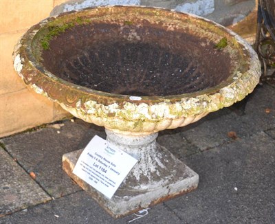 Lot 1164 - A Victorian cast iron garden urn, later painted, with egg and dart decorated border on pedestal...