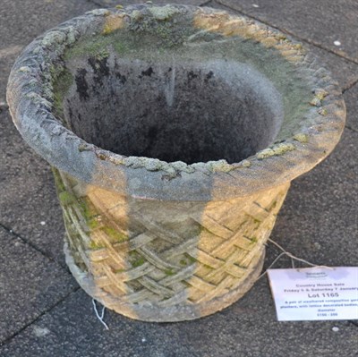 Lot 1165 - A pair of weathered composition garden planters, with lattice decorated bodies, 64cm diameter