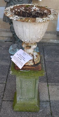 Lot 1170 - A pair of Victorian cast iron campana shaped garden urns, later painted and rusted, raised on...