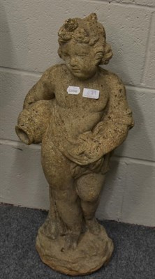 Lot 1179 - A reconstituted stone figure, depicting a semi-draped infant holding a vase, 74cm high
