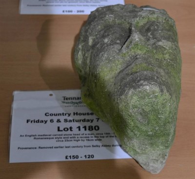 Lot 1180 - An English medieval carved stone head of a man, circa 15th - 16th century, of Romanesque style...