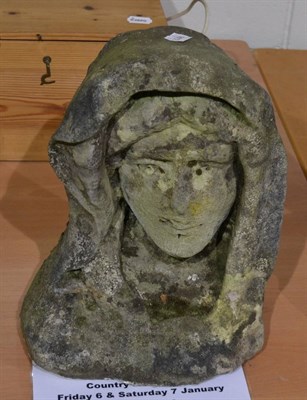 Lot 1181 - An English late medieval carved stone head of a woman or Saint, circa 16th century, 31cm high...