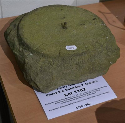 Lot 1182 - An English carved stone sundial, circa 17th - 18th century, the circular face bearing Arabic...
