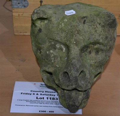 Lot 1183 - A large English late medieval carved stone lion head, circa 16th century, with Romanesque style...