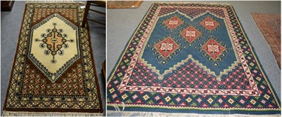 Lot 1197 - A Berber carpet, North West Africa, the mid indigo field with five diamond medallions enclosed...