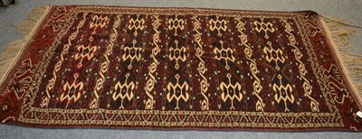 Lot 1198 - Yomut rug, North Khorasan, the field comprised of wide and narrow bands of hooked devices...