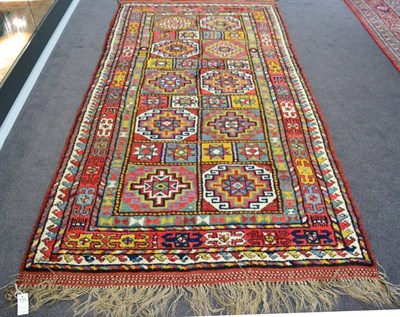 Lot 1201 - Kurdish rug, Iranian Kurdistan, the compartmentalised field with two columns of Memling güls...