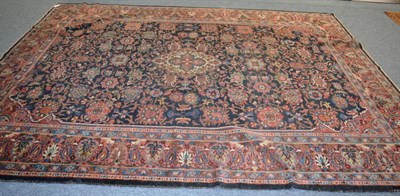 Lot 1212 - Feraghan carpet, West Iran, the indigo field with columns of stylised flowerheads around an...