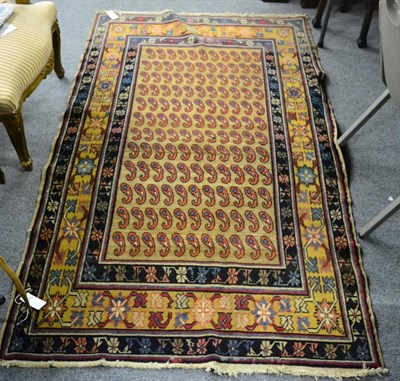 Lot 1213 - Unusual Azeri rug, North West Iran, the camel field of boteh enclosed by Harshang borders, 206cm by