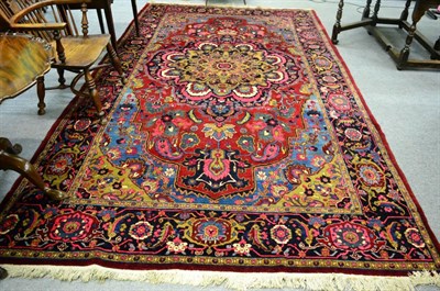 Lot 1223 - Heriz carpet, Iranian Azerbaijan, the blood red field centred by a polychrome pole medallion framed