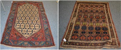 Lot 1229 - Heriz rug, Iranian Azerbaijan, the lozenge lattice field enclosed by spandrels and serrated...