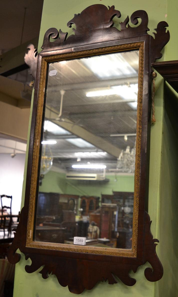 Lot 1589 - A reproduction walnut Vauxhall style rectangular mirror, gilt Greek key slip, fretted cornice...