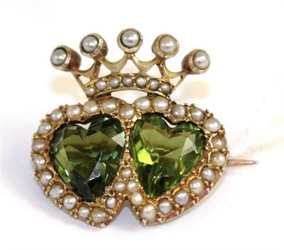 Lot 1 - A peridot and seed pearl double heart brooch, two heart cut peridot within seed pearl borders...