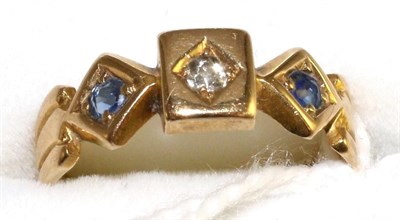 Lot 10 - An 18 carat gold diamond and sapphire three stone ring, an old cut diamond in a yellow star setting