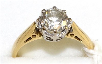Lot 21 - An 18 carat gold diamond solitaire ring, a round brilliant cut diamond in a white claw setting with