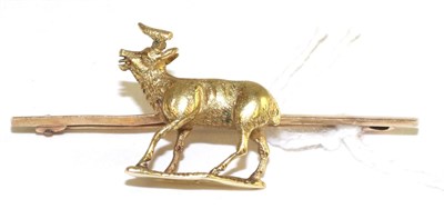 Lot 25 - A stag bar brooch, the stag realistically modelled in a walking pose with an open mouth, to a knife