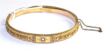Lot 29 - A Victorian 9 carat gold diamond set bangle, an old cut diamond in a yellow star setting with...