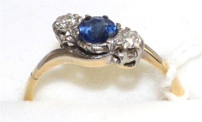Lot 34 - A sapphire and diamond three stone twist ring, a round cut sapphire between two old cut diamonds in