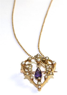Lot 44 - An Art Nouveau amethyst and seed pearl pendant/brooch on chain, an openwork frame set...