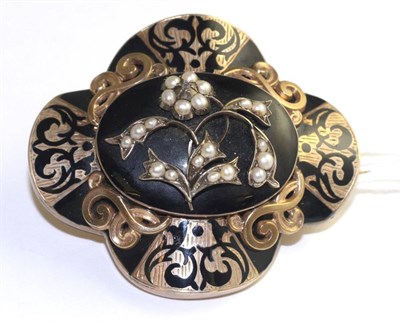 Lot 46 - A Victorian black enamel, pearl and diamond mourning brooch, a central floral motif set with...
