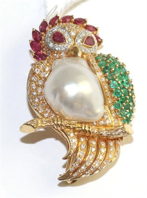 Lot 55 - A multi-gemstone owl brooch, set with marquise and pear cut rubies, round cut emeralds, round...