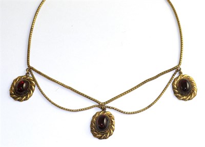 Lot 56 - A Victorian garnet necklace, three oval cabochon garnets in yellow rubbed over settings to rope...