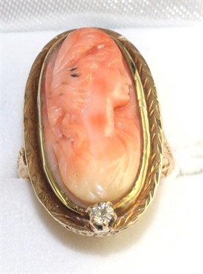 Lot 59 - A coral cameo and diamond ring, an oval coral cameo carved with a classical female bust in a yellow