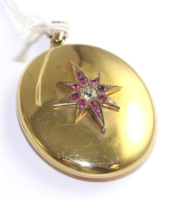 Lot 62 - A ruby and diamond locket, an old cut diamond within a border of round cut rubies in a star setting
