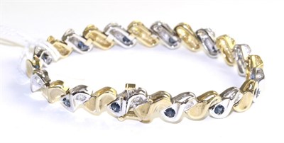Lot 81 - A sapphire and diamond bracelet, white S-shaped links inset with a round cut sapphire and round...