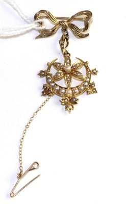 Lot 84 - An Edwardian seed pearl pendant, formed of a central flower above a crescent and set throughout...