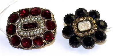 Lot 87 - A Victorian garnet and seed pearl brooch, a central bagette cut garnet within a border of split...