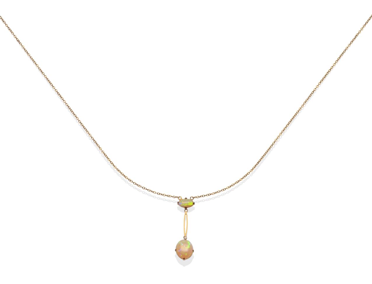 Lot 91 - An Edwardian opal necklace, an oval cabochon opal suspends a split bar to a larger oval...