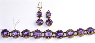Lot 92 - An amethyst bracelet and a pair of matching earrings, the bracelet with nine graduated round...