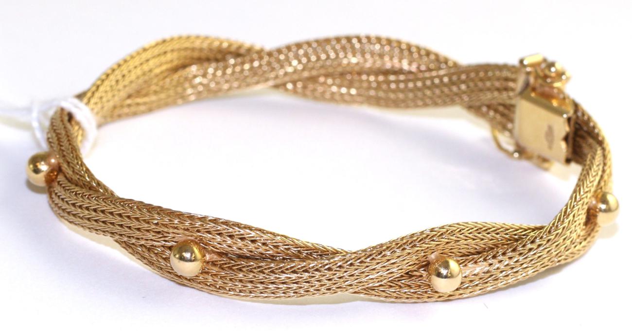 Lot 93 - A mesh bracelet, two woven strands with beaded decoration, length 18cm
