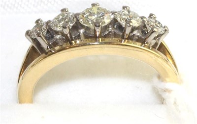 Lot 96 - An 18 carat gold diamond five stone ring, graduated round brilliant cut diamonds in white claw...