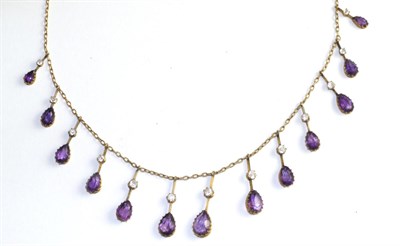 Lot 101 - An amethyst necklace, thirteen graduated drops each set with a pear cut amethyst suspended from...