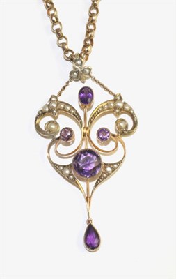 Lot 104 - An Art Nouveau amethyst and seed pearl pendant, the openwork pendant set throughout with...