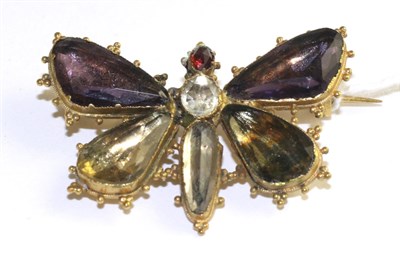 Lot 107 - A Georgian multi-gemstone butterfly brooch, with wings set with vari-cut amethyst and citrine, to a
